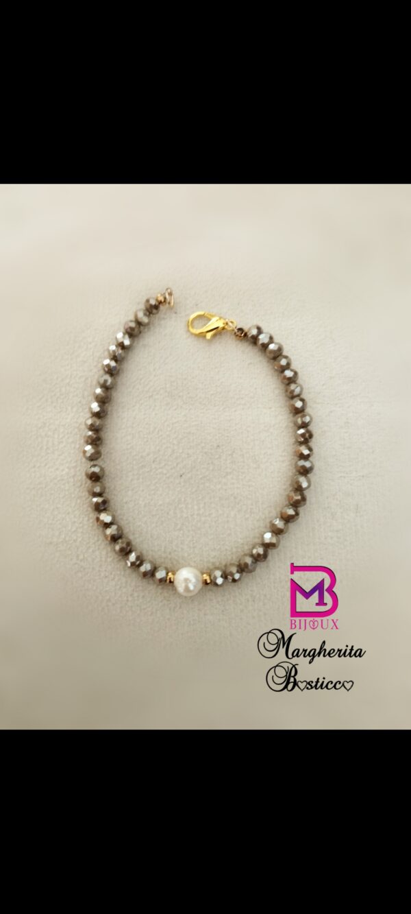 Bracciale della parure tortora e perle di fiume